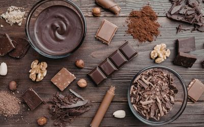 Premium cocoa, nuts and chocolate ingredients flat lay
